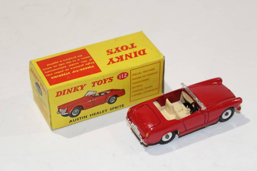 A Dinky Toys No. 103 Austin Healey '100' Sports, finished in cream, and a No. 109 Austin H